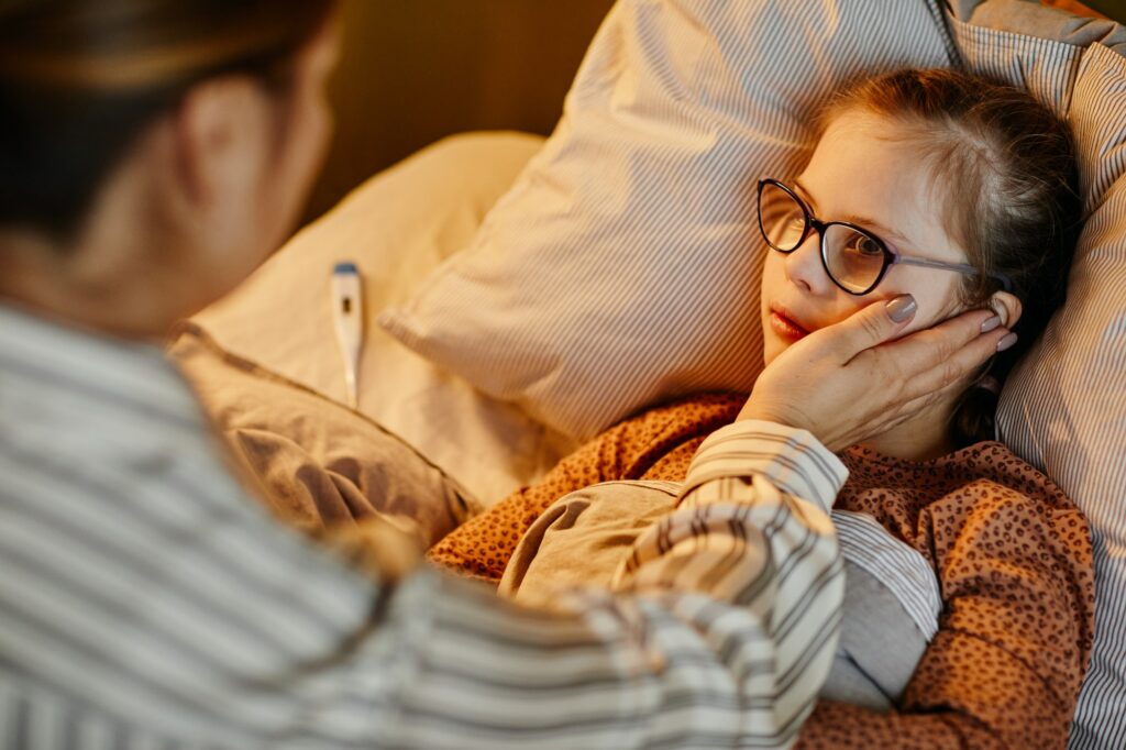 Mother Caring for Sick Daughter