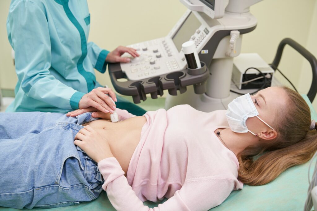 Young female person doing ultrasound health examination